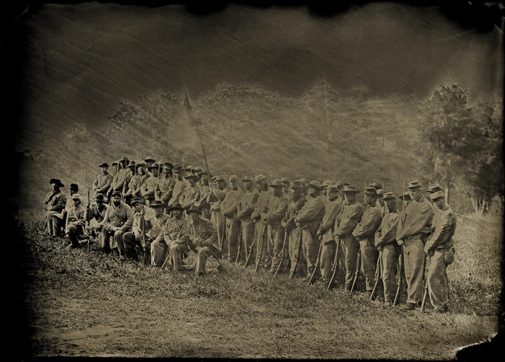 Confederate Civil War reenactors at South Mountain, Maryland show company strength following a battle. Wet plate photograph.
