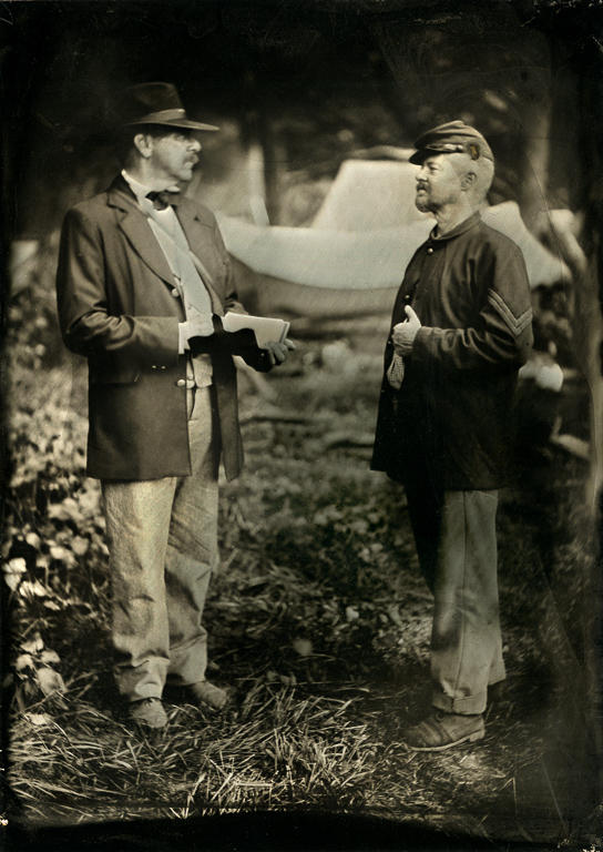 A journalist interviews a Union corporal at a Civil War reenactment in South Mountain, Maryland. Wet plate photograph.