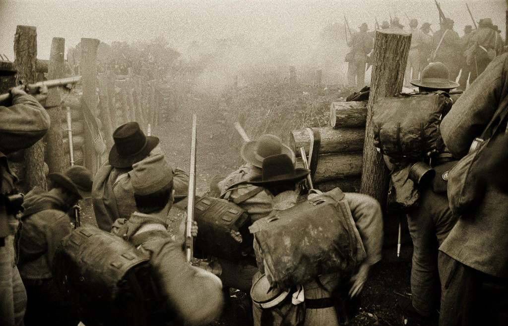 Confederate Civil War reenactors attempt to hold off Union soldiers breaching the trenches at the Battle of Spotsylvania in Virginia during a trench warfare scenario.